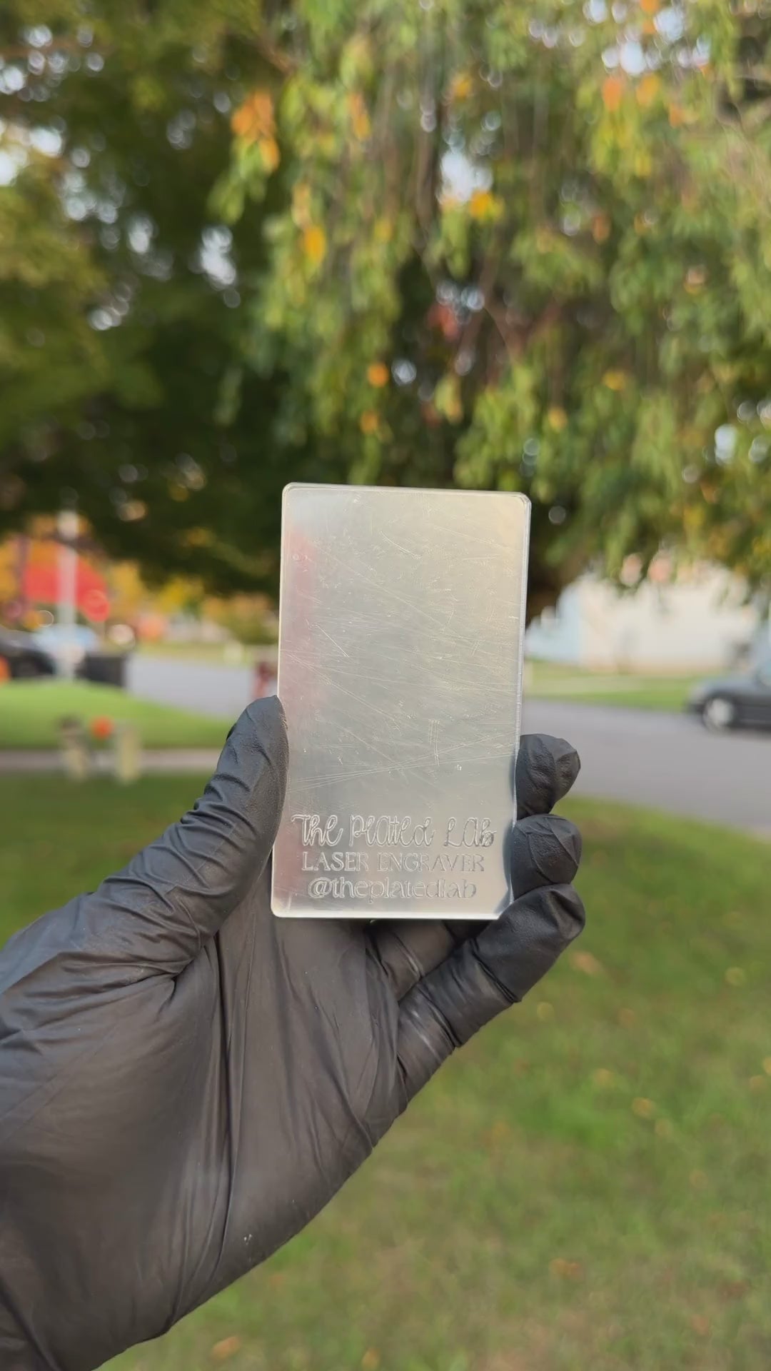Video of a mirror acrylic business card catching the light